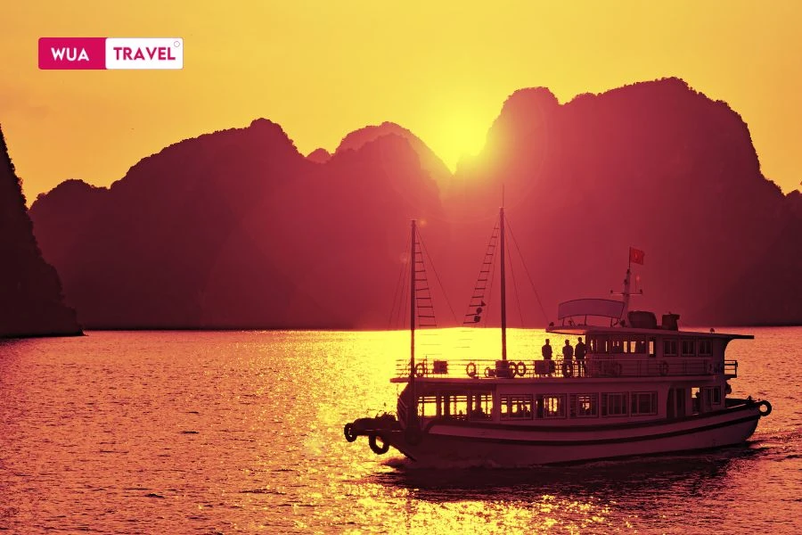 Ha Long Bay at sunset - natural wonder shimmering in golden twilight. 