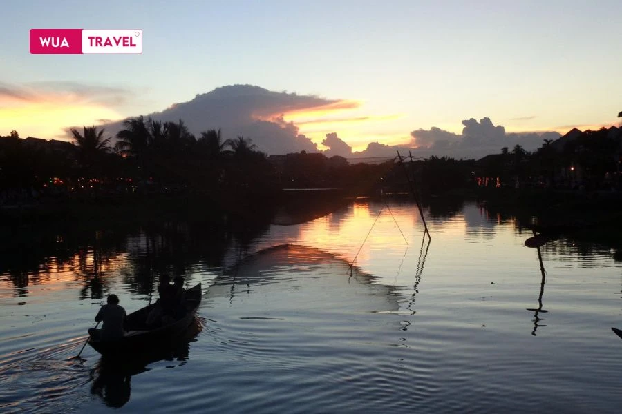 Hoai River Hoi An sunset - poetic river flowing in golden evening light
