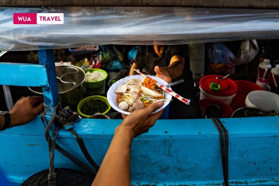 Hu tieu at floating market - distinctive Mekong Delta flavors on the waterways.