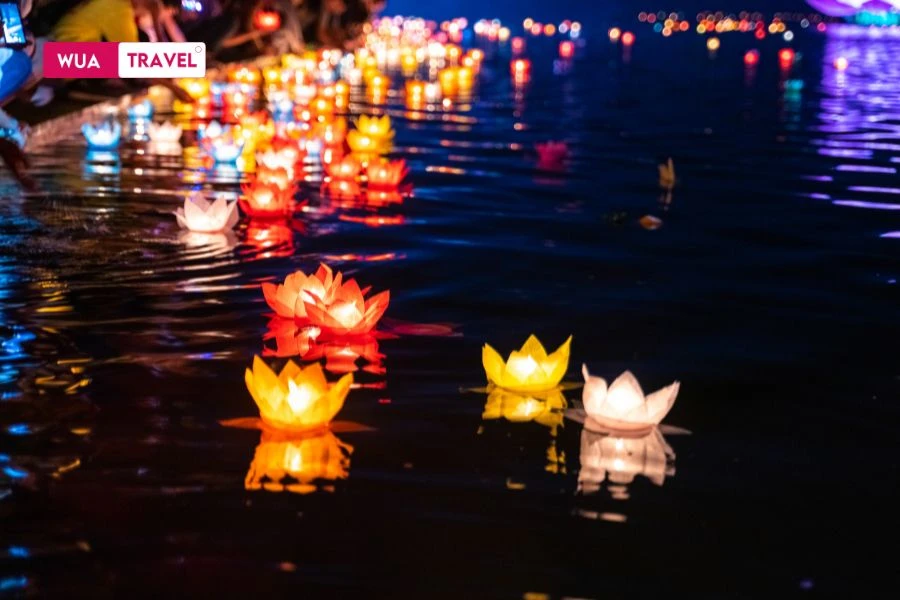 Floating lanterns on Hoai River – gentle lights carrying quiet wishes downstream.
