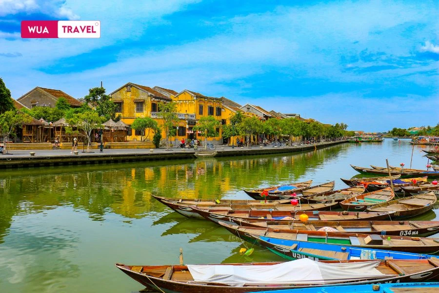 Hoi An on a clear day – golden walls glowing, ancient streets full of life.