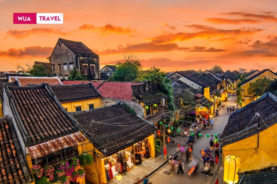 Hoi An sunset – golden light on ancient rooftops,