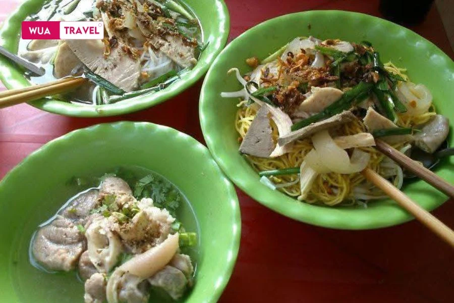 Hu Tieu Go – a humble noodle soup reflecting Saigon's vibrant nightlife.