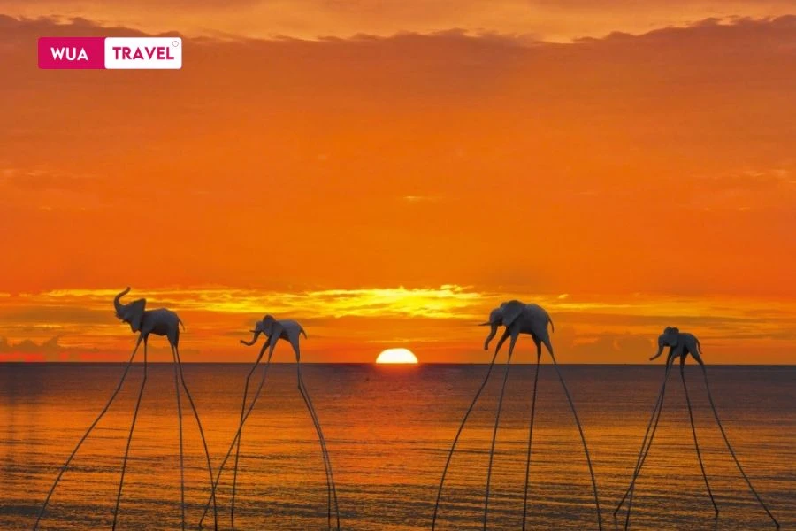 Sunset at Sunset Sanato – the sun dips below the sea, and everything falls beautifully still.